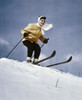 Low angle view of young woman skiing downhill Poster Print - Item # VARSAL25515310A