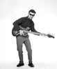 Portrait of young man playing base guitar Poster Print - Item # VARSAL255417684B
