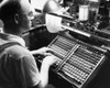 Side profile of a mid adult man operating a monotype machine Poster Print - Item # VARSAL25525521
