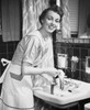 Portrait of a young woman hand washing clothes in the bathroom sink. Poster Print - Item # VARSAL25541730