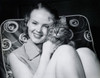 Close-up of a teenage girl hugging a cat and smiling Poster Print - Item # VARSAL25517463