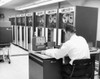 Rear view of a businessman sitting in a computer lab Poster Print - Item # VARSAL25512994