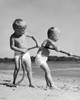 Two boys pulling a rope on the beach Poster Print - Item # VARSAL2552652