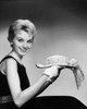 Portrait of a young woman holding a hat Poster Print - Item # VARSAL25541903