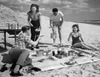 Two young couples on beach Poster Print