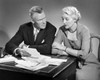 Senior couple sitting at a table and sorting out bills Poster Print - Item # VARSAL25519173A