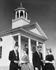 Two young couples standing in front of a church Poster Print - Item # VARSAL25543083