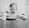 Boy eating breakfast cereal Poster Print - Item # VARSAL255424935