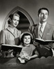 Mid adult couple and their daughter praying in church Poster Print - Item # VARSAL25519020