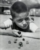Close-up of a boy playing marbles Poster Print - Item # VARSAL2553207