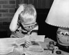 Boy looking at bills and scratching his head Poster Print - Item # VARSAL2551151B