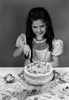 Portrait of girl cutting birthday cake Poster Print - Item # VARSAL255416706B