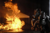 March 3, 2008 - Firefighters extinguish a simulated battery fire inside an aircraft fire trainer at Royal Air Force Mildenhall, England. Poster Print - Item # VARPSTSTK102685M