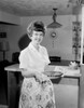 Housewife holding pie and smiling Poster Print - Item # VARSAL255419455