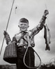 Portrait of a boy holding a dead fish and a fishing pole Poster Print - Item # VARSAL25514876