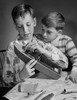 Close-up of two boys building a model Poster Print - Item # VARSAL2552308