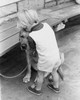 High angle view of a boy kissing his dog Poster Print - Item # VARSAL25514251