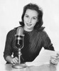Portrait of a female newscaster speaking in to a microphone Poster Print - Item # VARSAL2557804A