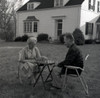 Senior couple playing chess  outside house Poster Print - Item # VARSAL255416398