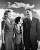 Mature couple standing with their son and smiling Poster Print - Item # VARSAL25519356