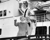 Portrait of senior couple waving from cruise ship Poster Print - Item # VARSAL25523993