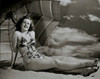 Young woman sitting on the beach Poster Print - Item # VARSAL2553335