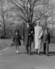Portrait of family with two children walking in park Poster Print - Item # VARSAL255422176
