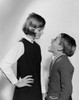 Girl checking her brother's mouth Poster Print - Item # VARSAL25516483