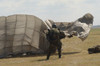 A member of the Pathfinder Platoon collapses his parachute after a HALO jump Poster Print - Item # VARPSTACH100014M