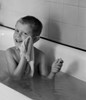 Boy  washing himself in bathtub Poster Print - Item # VARSAL255416460