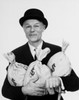 Portrait of a businessman holding three bags of money Poster Print - Item # VARSAL25534207