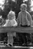 Boy and girl standing on rail fence Poster Print - Item # VARSAL2559984