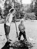 Mother and daughter cleaning leaves Poster Print - Item # VARSAL255416476