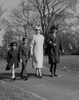 Family with two children walking in park Poster Print - Item # VARSAL255422206