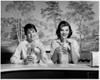 Portrait of two young women sitting in a restaurant Poster Print - Item # VARSAL25523899