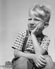 Boy sitting with hand on chin Poster Print - Item # VARSAL25512738