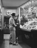 Mid adult couple standing in a jewelry store Poster Print - Item # VARSAL25527904