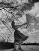 Woman holding umbrella in strong wind Poster Print - Item # VARSAL255422835