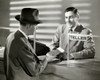 Mature man handing a bank book to a bank teller Poster Print - Item # VARSAL2553119