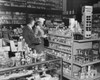 Side profile of a salesman standing with a customer in a store Poster Print - Item # VARSAL25515607