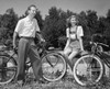 Young couple with bicycles in park Poster Print - Item # VARSAL2556887