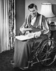Mature man sitting in a wheelchair and reading documents Poster Print - Item # VARSAL2553531A