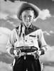Boy in cowboy costume holding toy guns Poster Print - Item # VARSAL25512963A