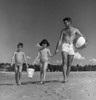Father  daughter and son walking along beach Poster Print - Item # VARSAL255418017