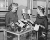 Female sales clerk showing jewelry to a customer in a jewelry store Poster Print - Item # VARSAL2551258