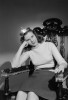 Studio shot of young woman wearing crown sitting in chair Poster Print - Item # VARSAL255422894