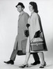 Side profile of a mid adult couple walking with luggage Poster Print - Item # VARSAL25544353