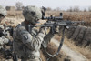 A U.S. Army soldier looks through the scope of his M-14 sniper rifle Poster Print - Item # VARPSTSTK104438M