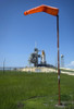 July 11, 2009 - Space shuttle Endeavour is framed by a windsock at Launch Pad 39A at the Kennedy Space Center in Florida awaiting launch on the STS-127 mission. Poster Print - Item # VARPSTSTK202801S