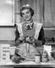 Young woman peeling apple in domestic kitchen Poster Print - Item # VARSAL2555847A